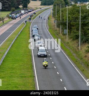 Forfar, Scotland, UK. 11th September, 2022. Queen Elizabeth II travels along the A90, Forfar, on route to Edinburgh, as large crowds gather to show their respect - 11th of September 2022, Angus, Forfar, Scotland, United Kingdom - Credit: Barry Nixon/ Alamy LIve News Stock Photo