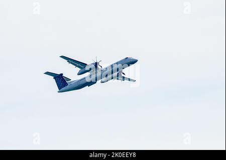 Toronto, Canada - September 10, 2022: A propeller plane taking of from the Porter Airport in the downtown district. Stock Photo