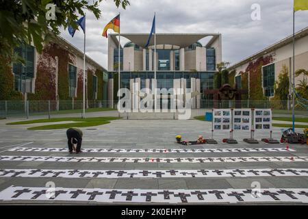 On the 200th day of the invasion of Ukraine by the Russian Federation, a memorial ceremony in honor of the killed Ukrainian children took place on September 11, 2022, in front of the Office of the Federal Chancellor, located at Willy-Brandt-Strasse 1 in Berlin, Germany's capital. According to the United Nations International Children's Emergency Fund, or UNICEF, nearly 1,000 children were killed or injured. UNICEF describes the situation of children from Ukraine as appalling. The lives of at least 7.5 million children are in danger and several million children are on the run. Most verified chi Stock Photo