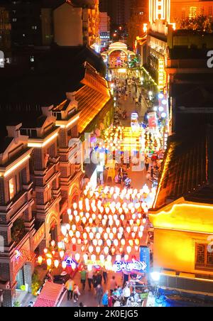 Lianyungang, China's Jiangsu Province. 10th Sep, 2022. Aerial photo shows people shopping at a night marketduring the Mid-Autumn Festival holiday in Lianyungang, east China's Jiangsu Province, Sept. 10, 2022. The three-day Mid-Autumn Festival holiday started on September 10 this year. Credit: Geng Yuhe/Xinhua/Alamy Live News Stock Photo