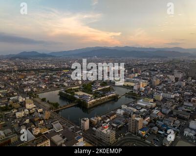 Aerial view of Imabari Castle and city landscape at dawn Stock Photo