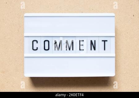 Lightbox with word comment on wood background Stock Photo