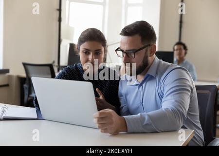 Two diverse business coworkers collaborating on project Stock Photo