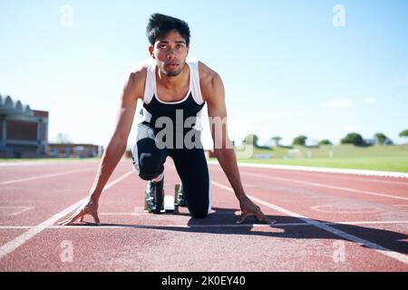 Hes got a one-track mind. A young sprinter focussing on his goals. Stock Photo