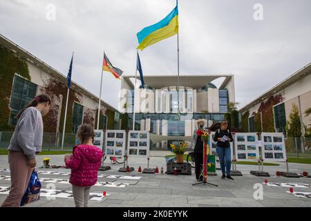 Berlin, Germany. 11th Sep, 2022. On the 200th day of the invasion of Ukraine by the Russian Federation, a memorial ceremony in honor of the killed Ukrainian children took place on September 11, 2022, in front of the Office of the Federal Chancellor, located at Willy-Brandt-Strasse 1 in Berlin, Germany's capital. According to the United Nations International Children's Emergency Fund, or UNICEF, nearly 1,000 children were killed or injured. UNICEF describes the situation of children from Ukraine as appalling. The lives of at least 7.5 million children are in danger and several million child Cre Stock Photo