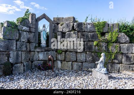 Our Lady’s Grotto in Tarmonbarry Village, Roscommon, Ireland. Refurbished and reopened in 2010, sculptor Michael Casey. Stock Photo