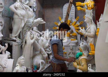 Kumartuli, Kolkata in West Bengal, India on 11th September, 2022: Clay idol of Hindu Goddess Durga under preparations for Bengal's Durga Puja festival