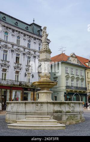 Bratislava, Slovakia - Aug 28, 2022:people near Maximilian Fountain at Main Square (Hlavne namestie) in Bratislava Town. Fountain construction was ord Stock Photo