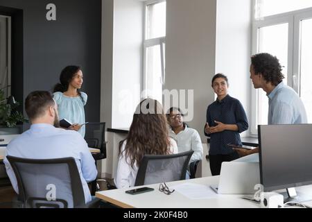 Young multiethnic business team brainstorming in office Stock Photo