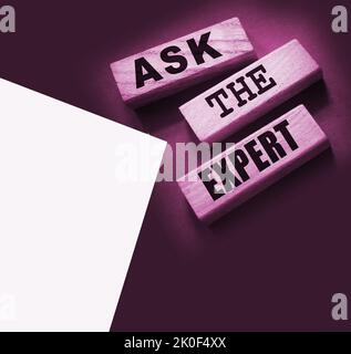 Ask the Expert words on wooden blocks. Consulting a professional, master or consultant for a solution and advice business concept Stock Photo