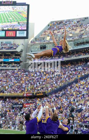 Baton Rouge, LA, USA. 10th Sep, 2022. A LSU cheerleader flies through the air performing a stunt prior to NCAA football game action between the Southern Jaguars and the LSU Tigers at Tiger Stadium in Baton Rouge, LA. Jonathan Mailhes/CSM/Alamy Live News Stock Photo