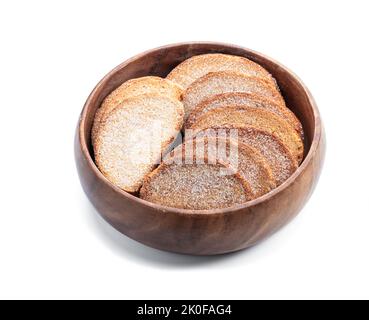Wheat  bread sweet crouton crackers in wooden bowl isolated on white Stock Photo