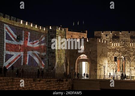 JERUSALEM, ISRAEL - SEPTEMBER 10: the Union Jack flag is projected against the walls of the old city near Jaffa gate following the death of Queen Elizabeth II on September 10, 2022 in Jerusalem, Israel. President Isaac Herzog is set to represent Israel at the funeral of Queen Elizabeth II, next week in London. Credit: Eddie Gerald/Alamy Live News Stock Photo