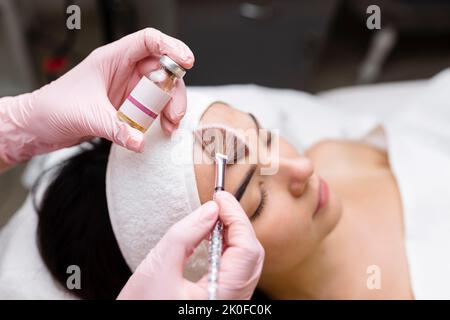 Chemical Peel Face Treatment with Retinol Serum. Stock Photo