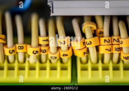 Close up circuit breakers and wire in control panel. Stock Photo