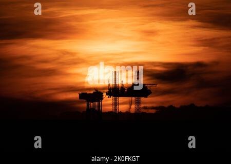 Sunset over the Lennox oil platform or rig in the Irish sea a few miles ...