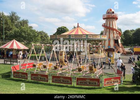 Swing boats, carousel and helter skelter, the funfair at Beamish Museum, England, UK Stock Photo