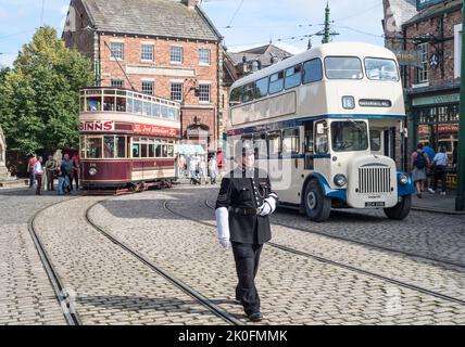 A 'Police Officer' directs traffic in the town at Beamish Museum, England, UK Stock Photo