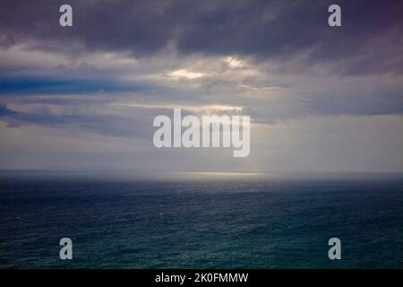 light catching off the coast from Neist Point, Isle of Skye,. Scotland Stock Photo