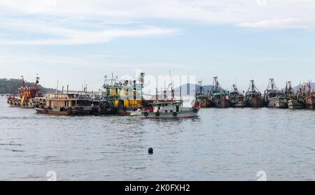Kota Kinabalu, Malaysia - March 23, 2019: Fleet of fishing boats moored in Kota Kinabalu on a sunny day Stock Photo