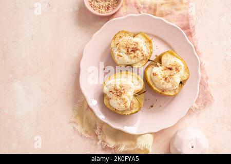 grilled pears baked with ricotta cheese and walnuts. honey topping Stock Photo