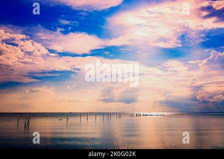 Mobile Bay is pictured from the May Day Park pier, Sept. 8, 2022, in Daphne, Alabama. The park was founded in 1887 and is one of 13 parks in Daphne. Stock Photo