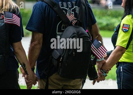 New York, USA. 11th Sep, 2022. New Yorkers hold a prayer circle during the 9/11 Memorial Service in New York, NY, on Sept. 11, 2022. (Photo by Gabriele Holtermann/Sipa USA) Credit: Sipa USA/Alamy Live News Stock Photo