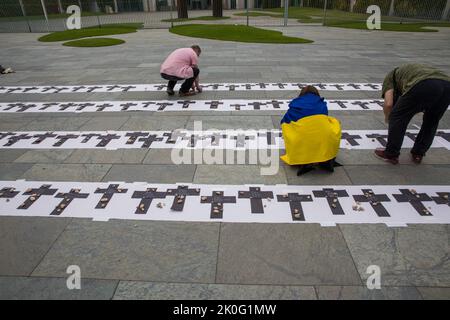 Berlin, Germany. 11th Sep, 2022. On the 200th day of the invasion of Ukraine by the Russian Federation, a memorial ceremony in honor of the killed Ukrainian children took place on September 11, 2022, in front of the Office of the Federal Chancellor, located at Willy-Brandt-Strasse 1 in Berlin, Germany's capital. According to the United Nations International Children's Emergency Fund, or UNICEF, nearly 1,000 children were killed or injured. UNICEF describes the situation of children from Ukraine as appalling. The lives of at least 7.5 million children are in danger and several million child Stock Photo