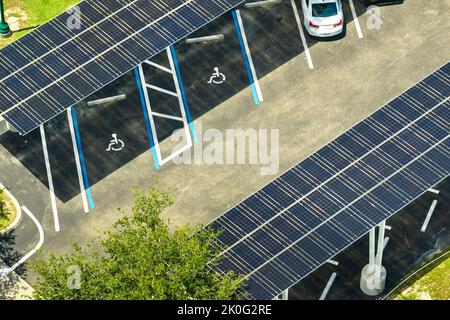 Solar panels installed over parking lot for parked cars for effective generation of clean energy Stock Photo