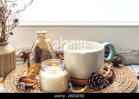 Cozy home composition with coffee cup and home decor details. Stock Photo