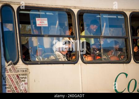 People inside the bus wearing protective mask against covid-19 on the streets of Salvador, Bahia. Stock Photo