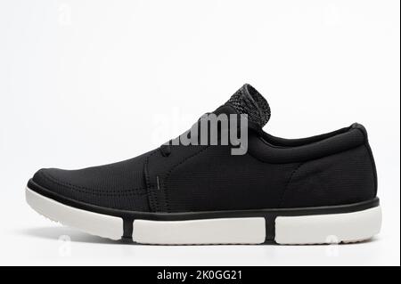 One clean black casual shoe side view isolated on white studio background Stock Photo