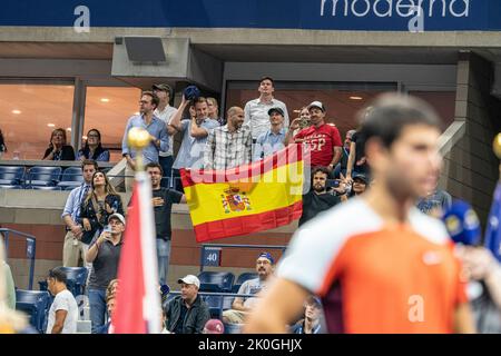 New York, NY - September 11, 2022: Fans with Spanish flag celebrate victory by Carlos Alcaraz in US Open Championships at Billie Jean King National Tennis Center