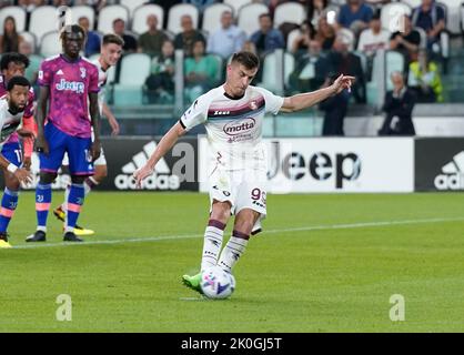 Turin, Italy. 11th Sep, 2022. Salernitana's Krzysztof Piatek scores a penalty kick during a Serie A football match between FC Juventus and Salernitana in Turin, Italy, on Sept. 11, 2022. Credit: Federico Tardito/Xinhua/Alamy Live News Stock Photo