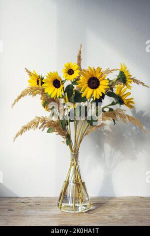 Autumn bouquet with sunflowers and pampas grass. Still life. Stock Photo