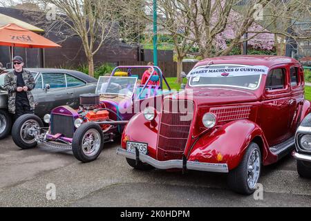 A 1935 Ford Coupe and a hot rod on display at a classic car show. Tauranga, New Zealand Stock Photo