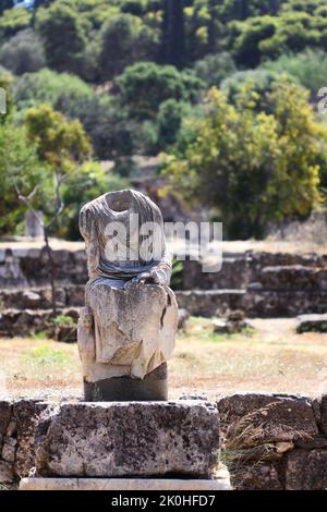 A vertical shot of a headless statue in the Palace of the Giants, Ancient Agora of Athens, Greece Stock Photo