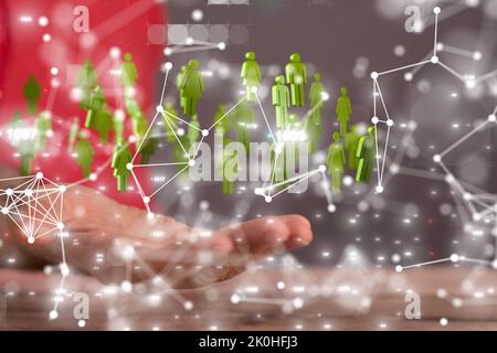 A group of 3D rendered people icons hovering over a man's hand Stock ...