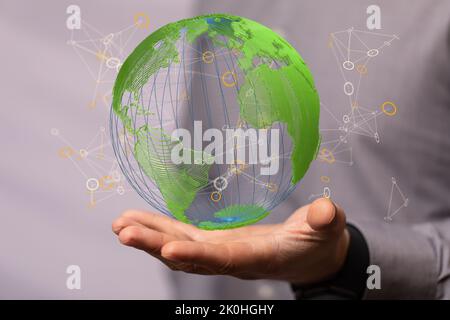 The hand presenting the green globe - world digital network concept Stock Photo