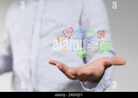 3d floating massage envelop icons over a hand- a concept of connection, networking Stock Photo