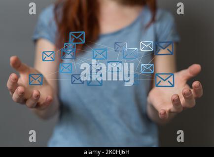 3d floating massage envelop icons between hands- a concept of connection, networking Stock Photo