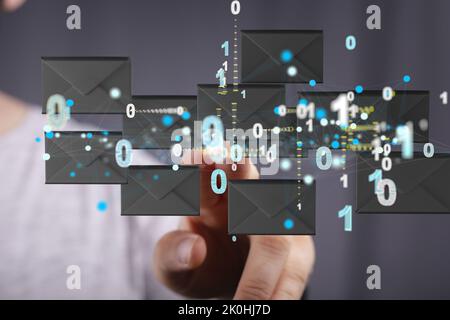 A finger pointing to 3d floating massage envelop icons - a concept of connection, networking Stock Photo