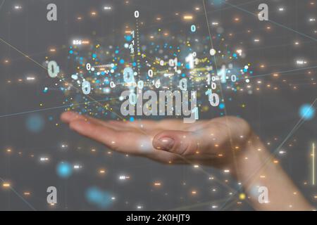 A 3d floating binary code over a hand - a concept of cybersecurity Stock Photo