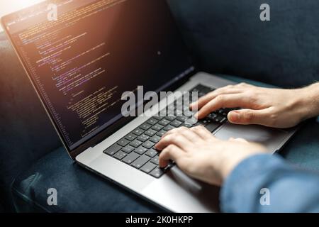 Coding on laptop Stock Photo
