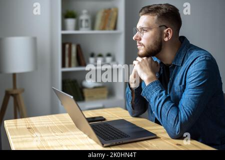 Thoughtful young man Stock Photo