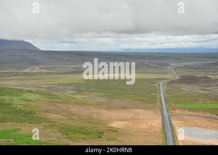 An aerial view of the lonely road in a valley near the high-temperature area in Hverir, Iceland Stock Photo