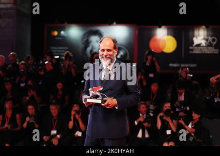 VENICE, ITALY - SEPTEMBER 10: Director Luca Guadagnino poses with the Silver Lion for Best Director for 'Bones And All' duringthe award winners photoc Stock Photo