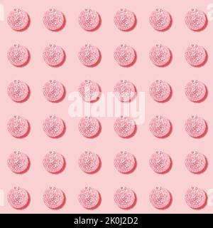 Holiday Christmas seamless pattern of pink Christmas balls on pastel pink backdrop.Xmas decorations. Festive square background or wallpaper. Stock Photo
