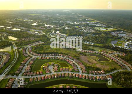 Aerial view of tightly located family houses in Florida closed suburban area. Real estate development in american suburbs Stock Photo