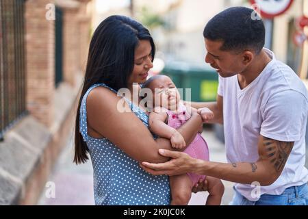 Hispanic family smiling confident hugging each other at street Stock ...
